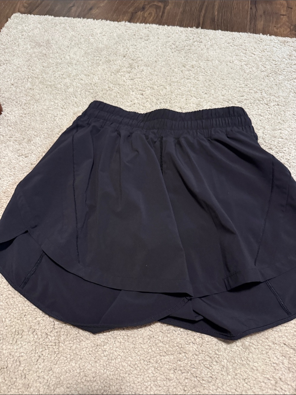 Womenโs Lululemon Black track that 5โ shorts